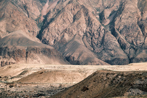 istock Broad perspective of a mountainous desert in subtle tones 2160697315