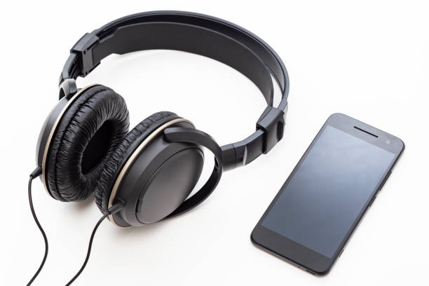 istock Headphones and smartphone on white background 2160697505