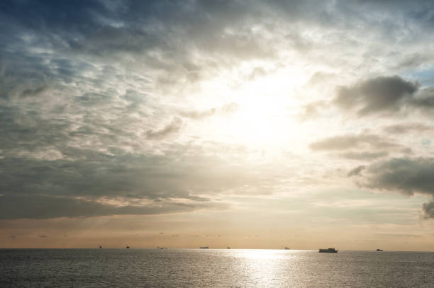 Beautiful landscape with dramatic sky, sea water, ship and islands