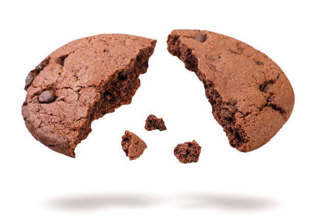 istock Chocolate chip cookie broken in half flying on white background. Isolated 2160702977