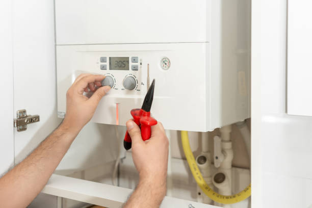 istock Technician repairing the boiler 2160704041
