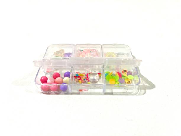 istock Colorful beads in boxes isolated on white background 2160705176