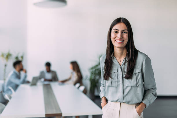 istock Confident businesswoman and her team. 2160707351