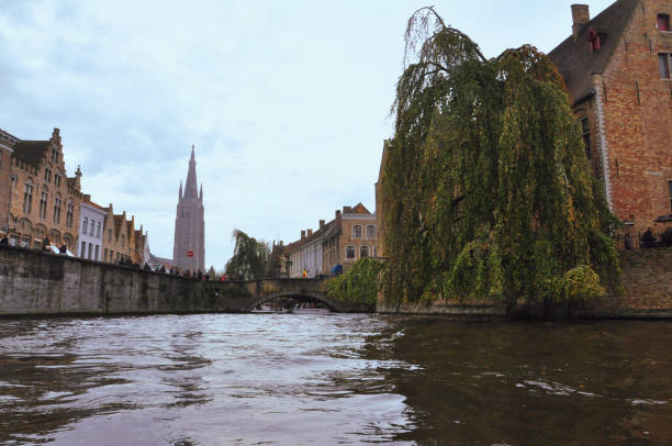30-10-2014 Brussels, Belgium - View of Our Lady's Church tower from boat on Rosary Quay canal
