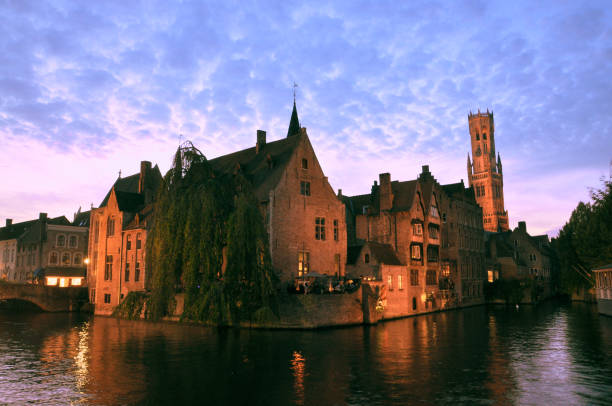 30-10-2014 Brussels, Belgium - Rosary Quay (Rozenhoedkaai) glows warmly under streetlights, reflecting on Bruges canal at night