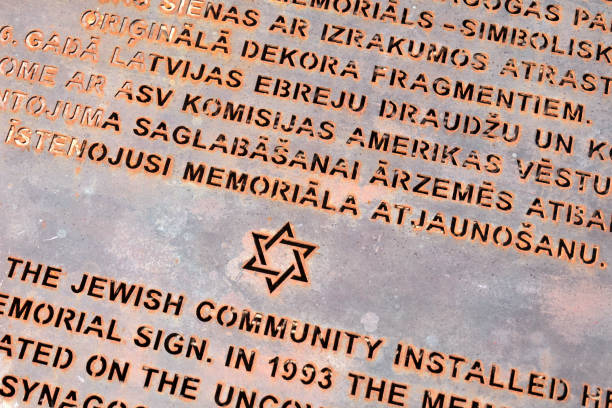 Riga, Latvia 06 07 2024 Metal sign at the site burnt down Great Choral Jewish Synagogue in Riga, with star of david cut into the metal.
