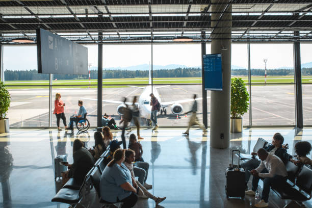 istock Diverse People Casually Waiting At Departures Terminal 2160708267