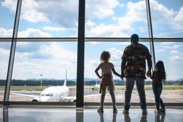 istock Black Father Entertaining His Two Mixed Race Daughters At The Airport 2160708668