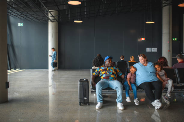 istock Diverse Family Waiting For A Flight 2160708673