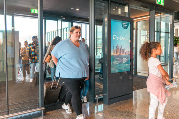 istock Real People Walking At The Airport 2160709390