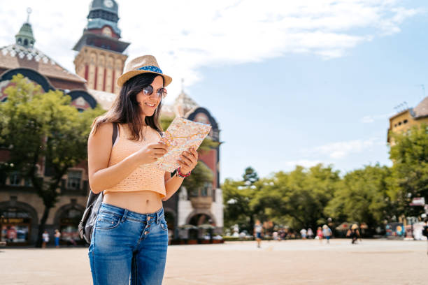 istock Young Female Tourist Reading A Map In Subotica 2160710198
