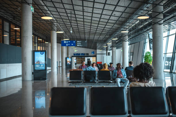 istock People Waiting In A Departures Lounge 2160710286