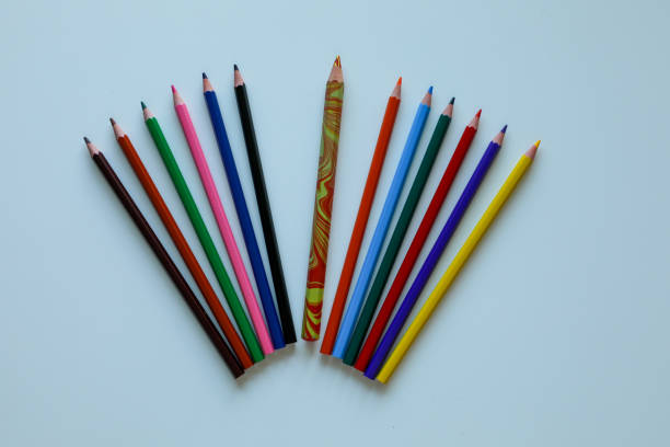 istock Colored pencils are beautifully laid out on a white background. 2160710747