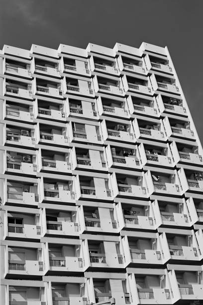 Faro, Portugal, April 18th 2024: Black and white low angle view on residential apartment block.