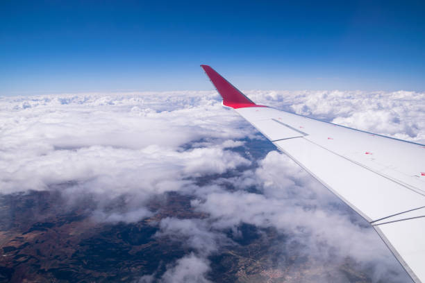 Panoramic view of the earth and clouds from the airplane window