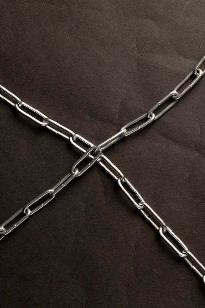silver steel chain on a black background, steel chain links connected together