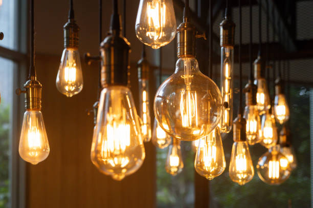 istock A bunch of light bulbs hanging from the ceiling 2160722356