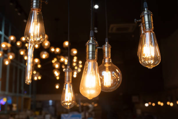 istock A bunch of light bulbs hanging from the ceiling 2160722372