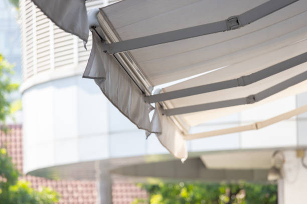 istock A white awning with a broken section is hanging over a building 2160722556
