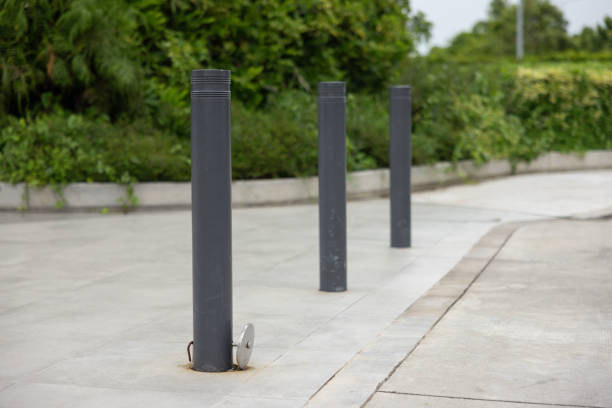 istock Three black poles are standing in a parking lot 2160723014