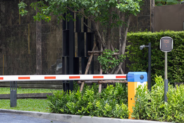 istock A red and white barrier with a yellow and blue sign on it 2160723185