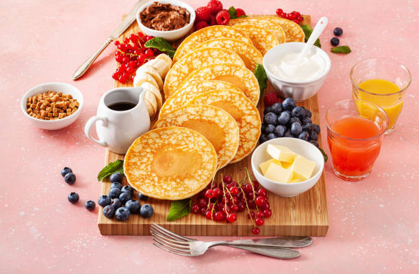 istock american pancake board with berries maple syrup butter 2160723767