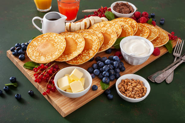 istock american pancake board with berries maple syrup butter 2160723807