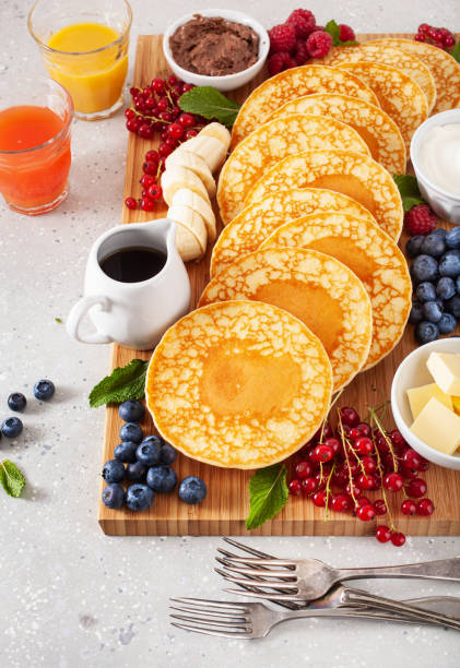 istock american pancake board with berries maple syrup butter 2160723823