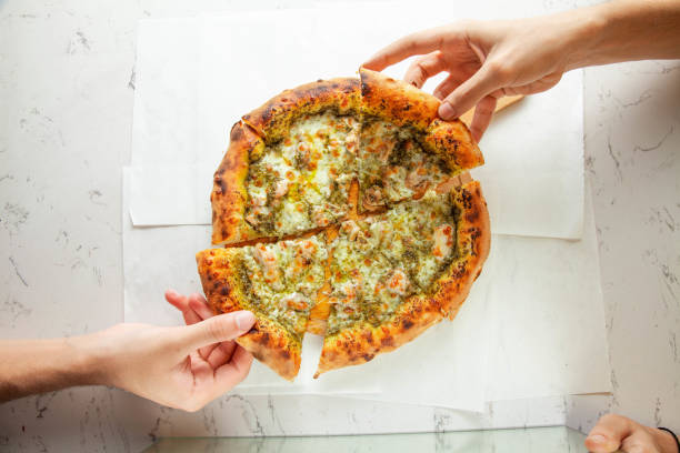 istock Pesto sauce naples styled authentic pizza brick oven freshly made eating. 2160723960