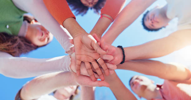 istock Friends, group and hands together with low angle outdoor for teamwork, unity and support in nature. People, team building and solidarity for collaboration, partnership and motivation with community 2160723974