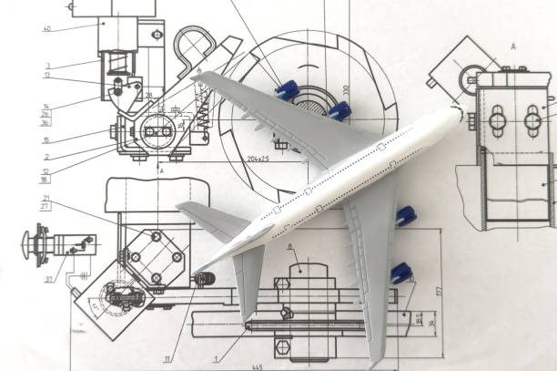 Image of passenger airplane and engineering blueprint