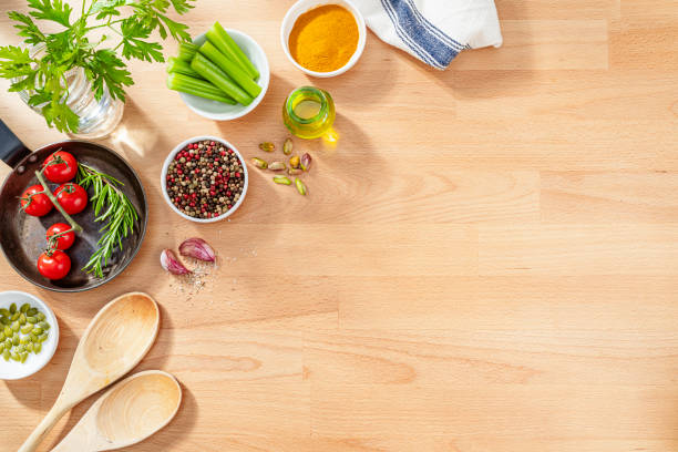 Fresh organic cooking ingredients on hardwood background. Copy space.