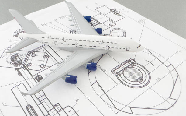 istock Image of passenger airplane and engineering blueprint 2160725235