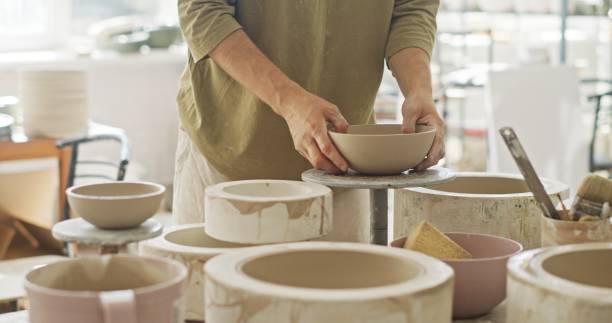 istock Artisan Potter Inspecting Newly Molded Ceramic Bowl in Studio 2160725706
