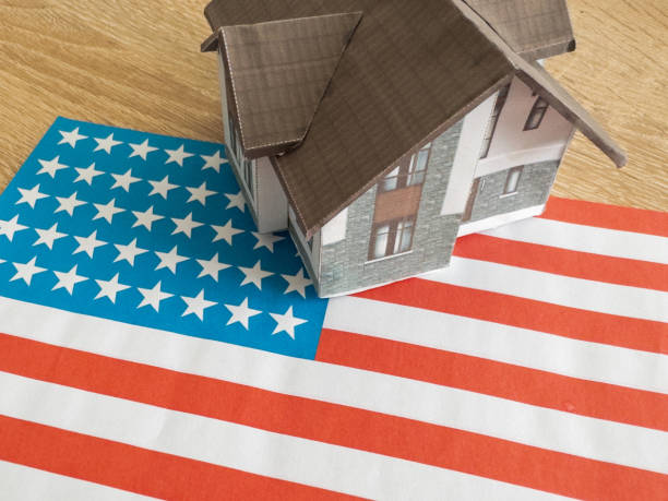 istock house on American flag background 2160725912