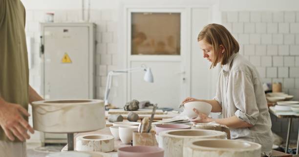 istock Artisan Couple Creating Ceramic Pieces in Their Pottery Studio 2160726491