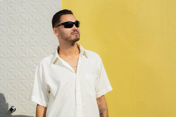 istock Handsome and stylish young man wearing sunglasses smiling. 2160728455