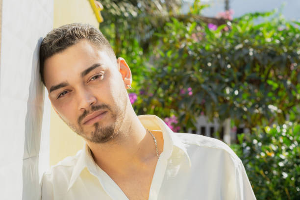 Outdoor portrait of a handsome smiling and confident young man.