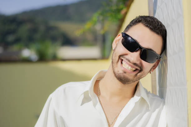 Outdoor portrait of a handsome smiling and confident young man.