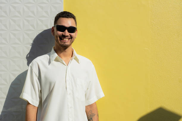 istock Handsome and stylish young man wearing sunglasses smiling. 2160728632