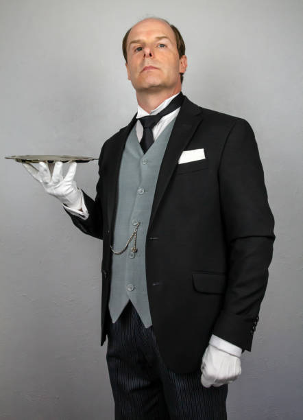 istock Formal Butler Holding Serving Tray 2160732177
