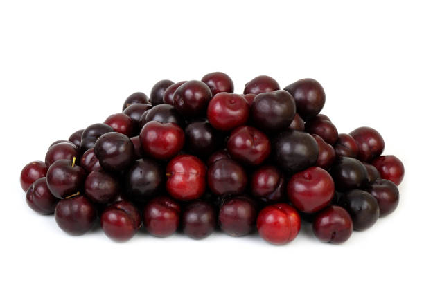 istock Heap of  ripe plums isolated on white 2160734788