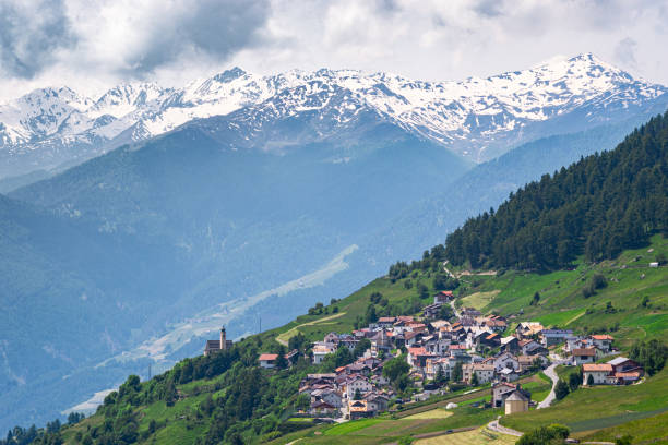 istock Italian village and snow covered mountains 2160734953