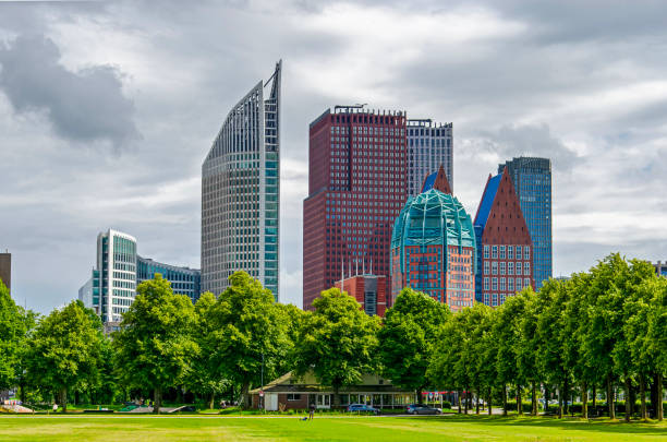 The Hague, The Netherlands, June 16, 2024: several modern skyscrapers with in the foreground Malieveld park, often used for rallies and concerts