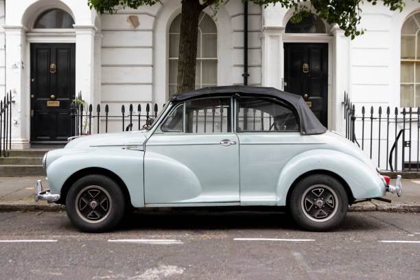 Morris Minor car parked outside houses on a street in Pimlico, London