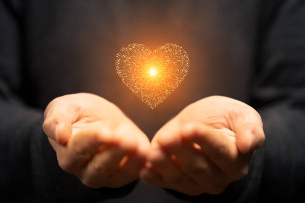 istock Artificial intelligence Circuit board heart symbol in mens hand on dark background 2160742688