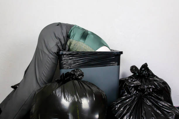 istock Businessman Stuck in Garbage Can 2160743631