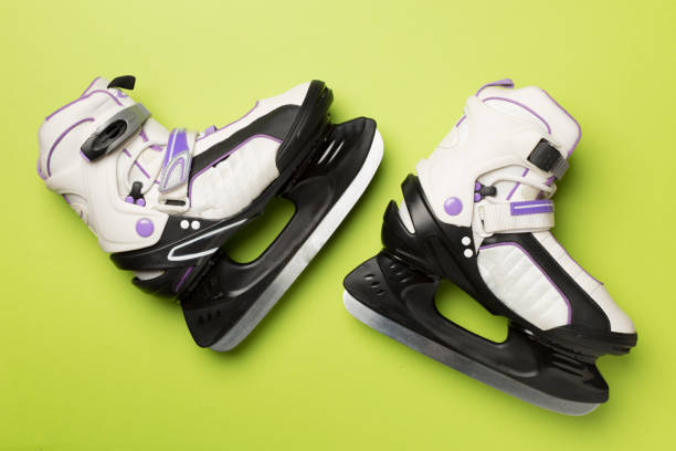 istock Ice skates on color background, top view 2160744748