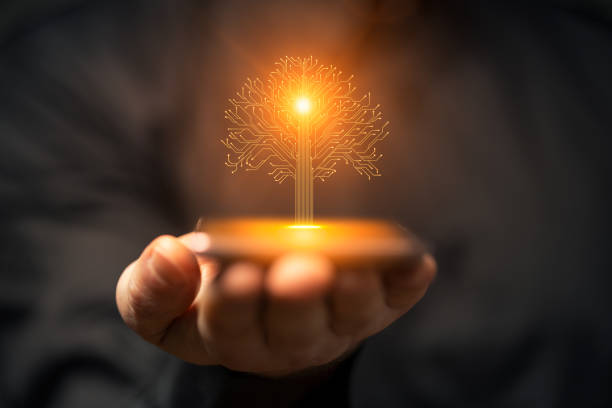 istock Artificial intelligence new life tree symbol on smartphone in hand 2160745358