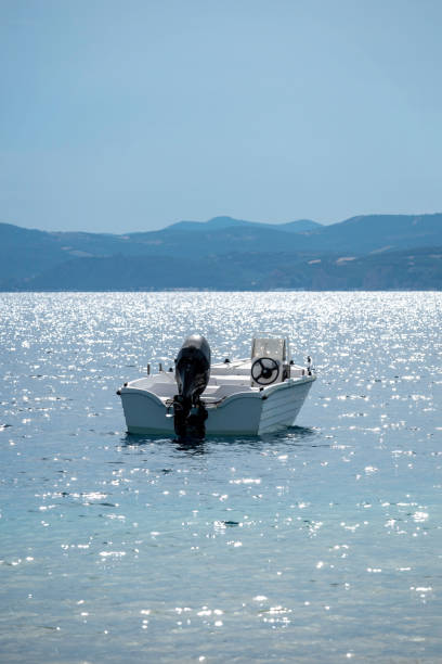 istock boat on sparkling sea 2160745555